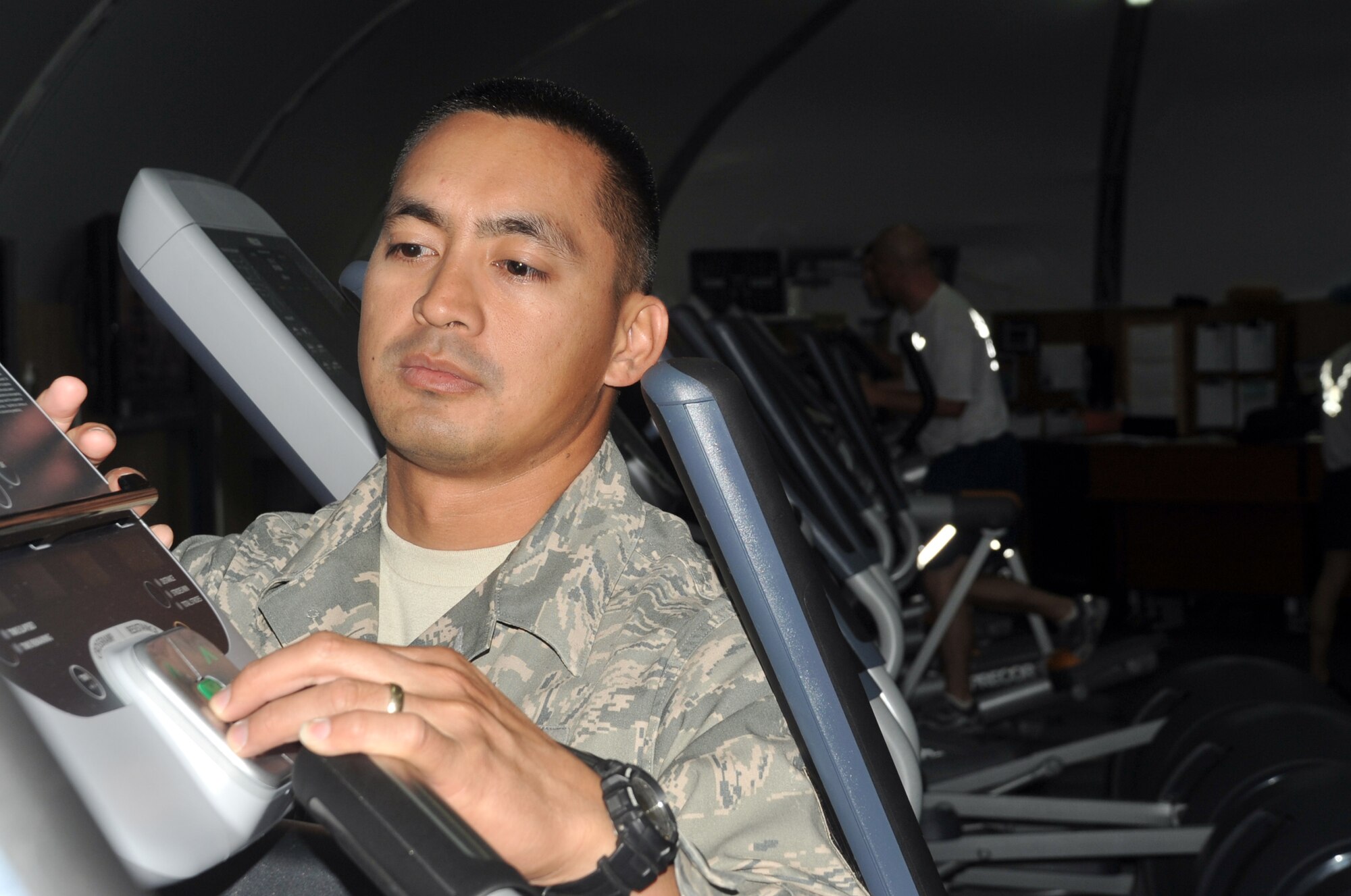 Master Sgt. Greg Ramos, superintendent of the fitness center for the 380th Expeditionary Force Support Squadron, works on equipment in the fitness center at a non-disclosed base in Southwest Asia on April 14, 2010. Sergeant Ramos is deployed from the 154th Force Support Squadron at Hickam Air Force Base, Hawaii, and his hometown is Kapolei, Hawaii. (U.S. Air Force Photo/Master Sgt. Scott T. Sturkol/Released)