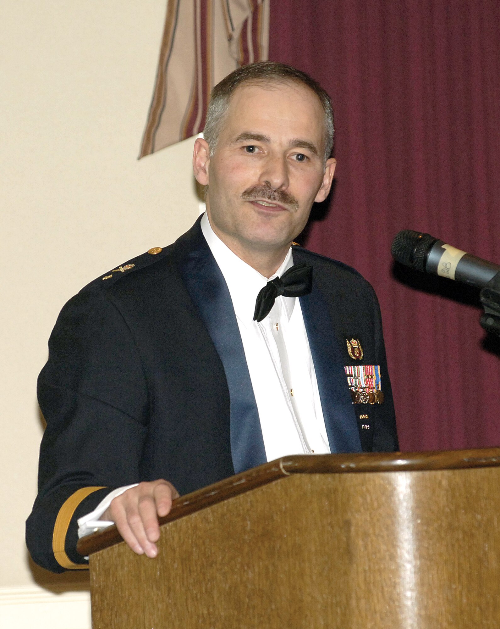 Brig. Gen. Rick R. Pitre , commander of the 2nd Canadian Air Division, speaks  at the Royal Canadian Air Force’s 86th birthday celebration at the Tinker Club. (Air Force photo by Margo Wright)