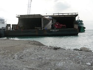 PORT-AU-PRINCE, Haiti -- A vessel waits here in April to be loaded with supplies from the 823rd Expeditionary Security Forces Squadron. Deployed from Moody, the squadron was tasked to provide security at the Toussaint L'Ouverture International Airport in Port-au-Prince, Haiti. It took dozens of servicemembers approximately 15 hours to load 184 tons of the 823rd ESFS’s cargo onto the ship to be transported back to the United States. (Contributed photo/RELEASED)