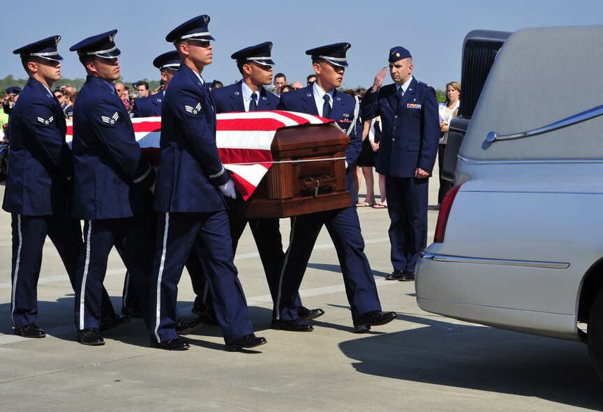 Members of the Hurlburt Field Honor Guard load the casket of Maj. Randell Voas into a hearse that will transport him to his funeral site April 16. Major Voas and Senior Master Sgt. James Lackey, assigned to the 8th Special Operations Squadron as an evaluator pilot and evaluator flight engineer, respectively, died in the line of duty when their CV-22 crashed in Afghanistan April 9. (DoD photo by Senior Airman Sheila deVera)
