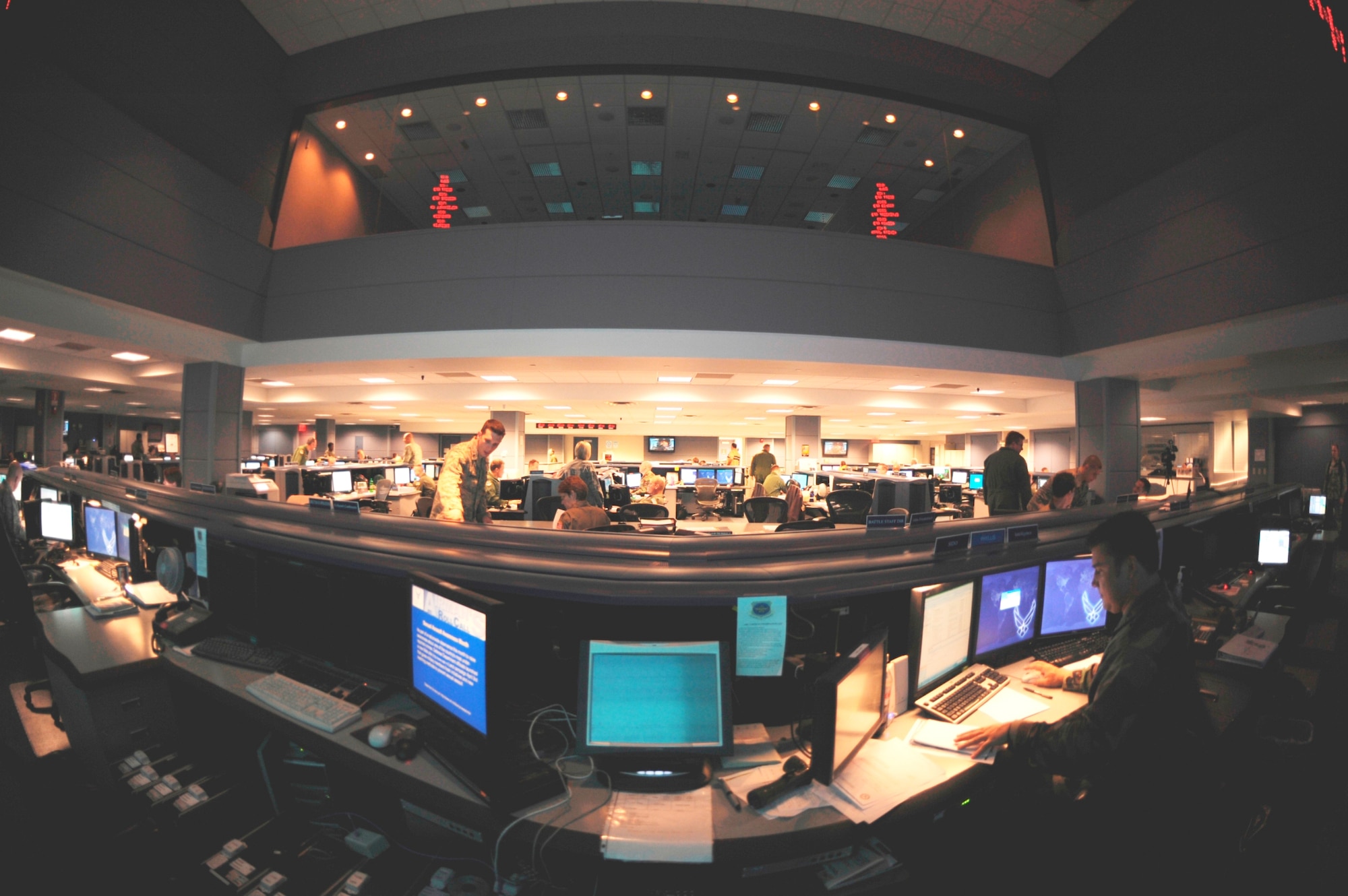 Members of the 618th Tanker Airlift Control Center coordinate with aircrews, maintenance personnel and aerial porters around the world from the 618th TACC operations floor March 17, 2009, at Scott Air Foce Base, Ill. (U.S. Air Force photo/Staff Sgt. Desiree Palacios)