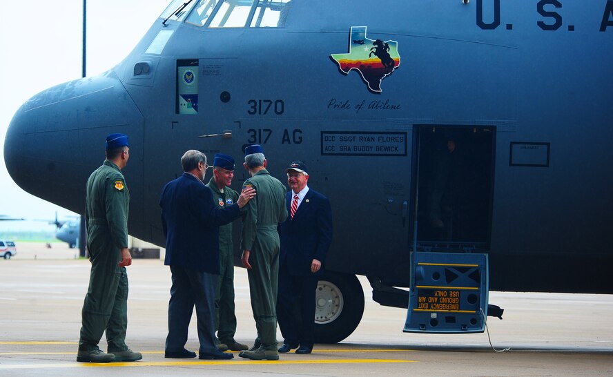 DYESS AIR FORCE BASE, Texas—(From left to right) 317th Commander Col. Dan Dagher, Abilene Chamber of Commerce representative James Webster, 7th Bomb Wing Commander Col. Robert Gass, Air Force Chief of Staff Gen. Norton Schwartz and Texas Congressman Randy Neugebauer exchange handshakes April 16 during the delivery of the first C-130J model to the 317th Airlift Group here. This C-130J is the first of 28 to be delivered by 2013 to replace the current aging fleet. The C-130J offers many improvements over the current C-130H models to include improved avionics, an enhanced cargo handling system and more. (U.S. Air Force photo/ Senior Airman Stephen Reyes)