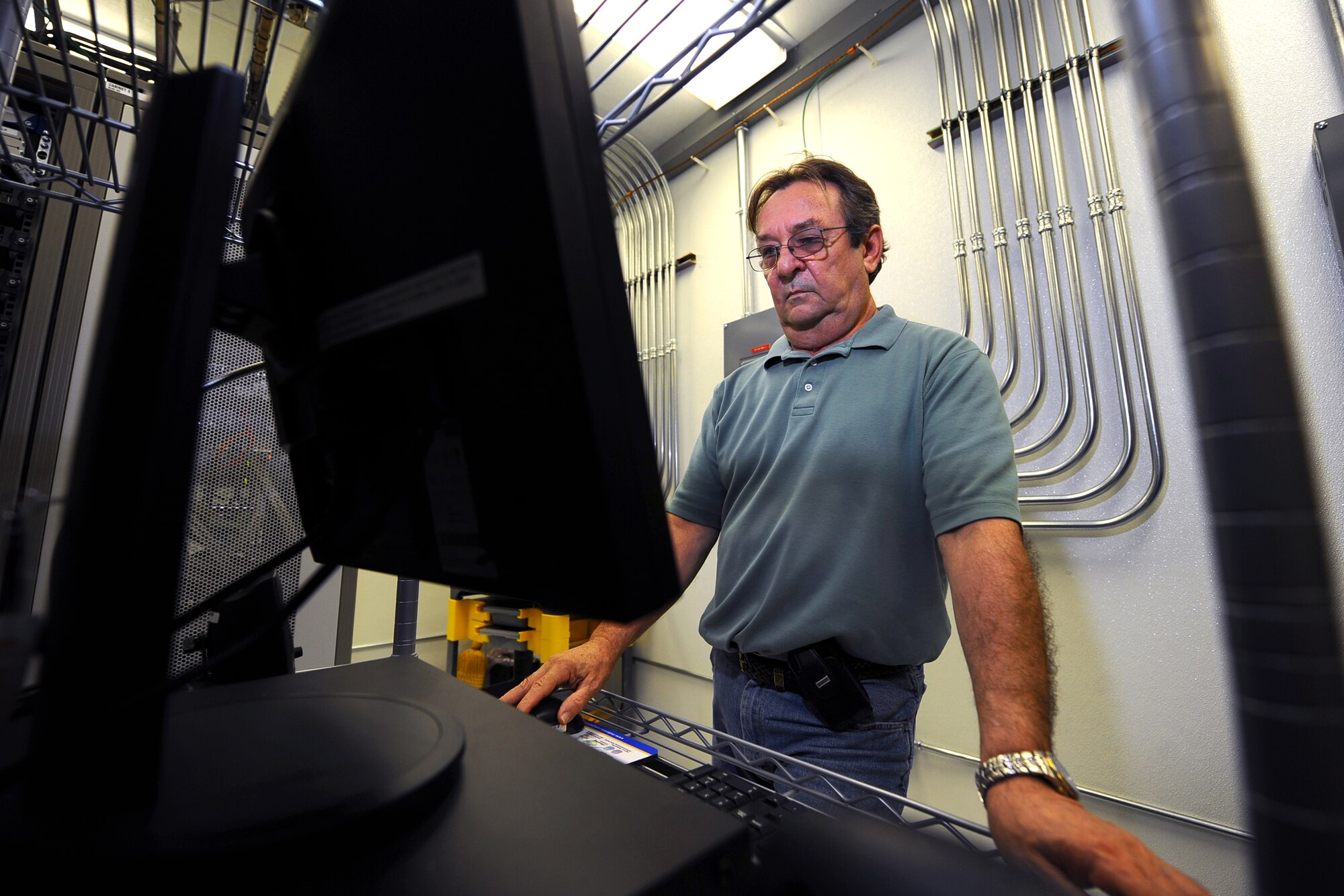 OFFUTT AIR FORCE BASE, Neb. - Ken Lemke, the Installation Spectrum Manager with the 55th Communications Squadron, uses computer software to monitor all radio frequencies here, as well as the source and affected areas of frequency interruption April 15. Rogue radio frequencies can momentarily cross with Offutt's radio waves which is common. Mr. Lemke uses various tools to pinpoint the exact location of such disturbances and remove them through various means. Mr. Lemke was recently announced as the Communications and Information career field's Outstanding ISM award winner for 2009. U.S. Air Force Photo by Josh Plueger
Rogue radio frequencies can momentarily cross with Offutt's radio waves which is common.  

U.S. Air Force Photo by Josh Plueger
