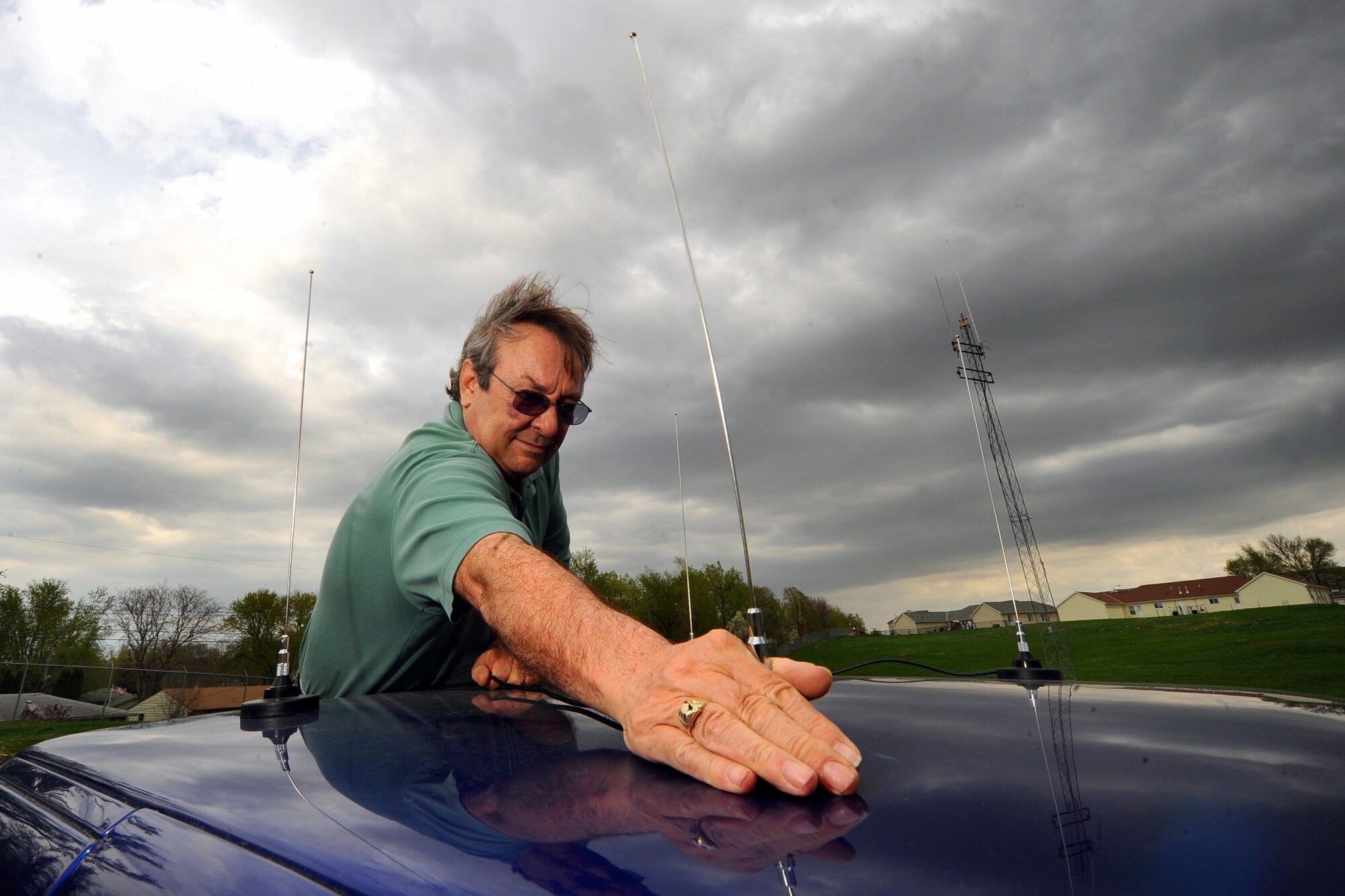 OFFUTT AIR FORCE BASE, Neb. - Ken Lemke, the Instillation Spectrum Manager with the 55th Communications Squadron, places antennas on the roof of a truck here April 15, which are used to find the direction of radio frequencies that may interfere with the 55th Wing's mission. Rogue radio frequencies can momentarily cross with Offutt's radio waves which is common. Mr. Lemke uses various tools to pinpoint the exact location of such disturbances and remove them through various means. Mr. Lemke was recently announced as the Communications and Information career field's Outstanding ISM award winner for 2009. U.S. Air Force Photo by Josh Plueger
