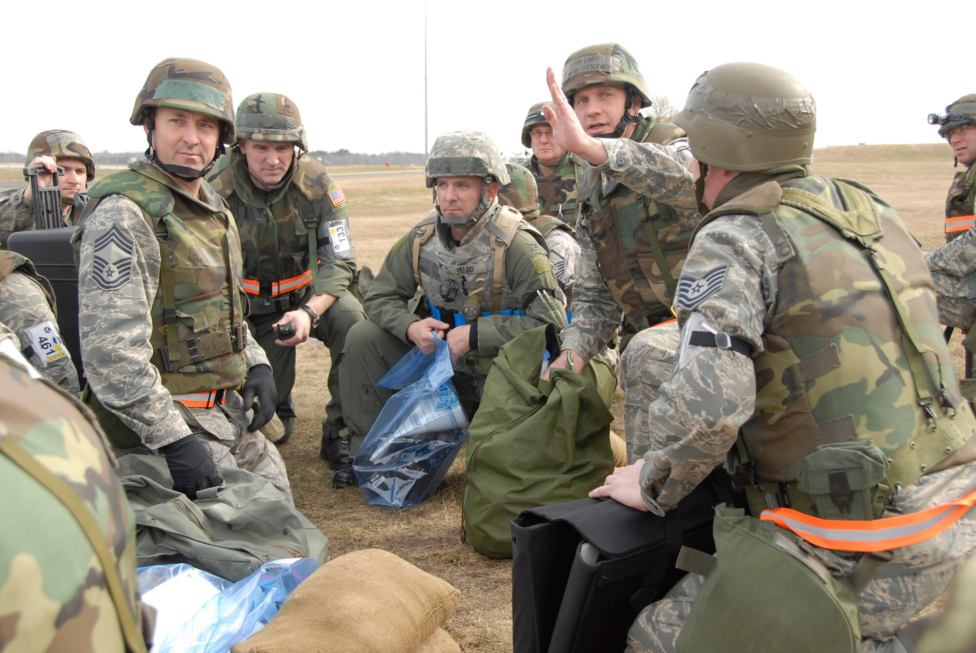 Cpt. David Stickney of the 133rd AW briefs CMSgt Paul Kessler of the 133rd AW, Col. Greg Haase, 133rd AW Wing Commander and Col. Terry Ward, 375th AMW Ops Group Commander,  on the relocation plans after a building  evacuation during an operational readiness inspection at Volk Field, WI on 03/24/2010.