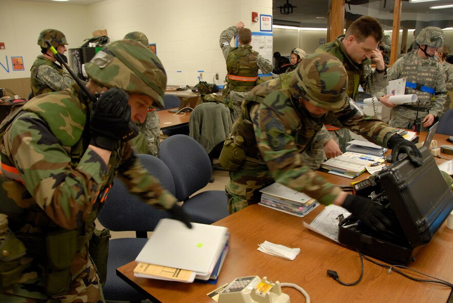 Members of the 103rd AEW evacuate the UCC during an operational readiness inspection at Volk Field, WI on 03/24/2010.