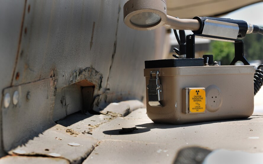MOODY AIR FORCE BASE, Ga. -- A survey meter is placed on top of the wing of an F-105 Thunderchief static aircraft here April 12. This meter is able to detect the type and energy of radiation emitted by any radioactive material. (U.S. Air Force photo by Airman 1st Class Benjamin Wiseman/RELEASED)
