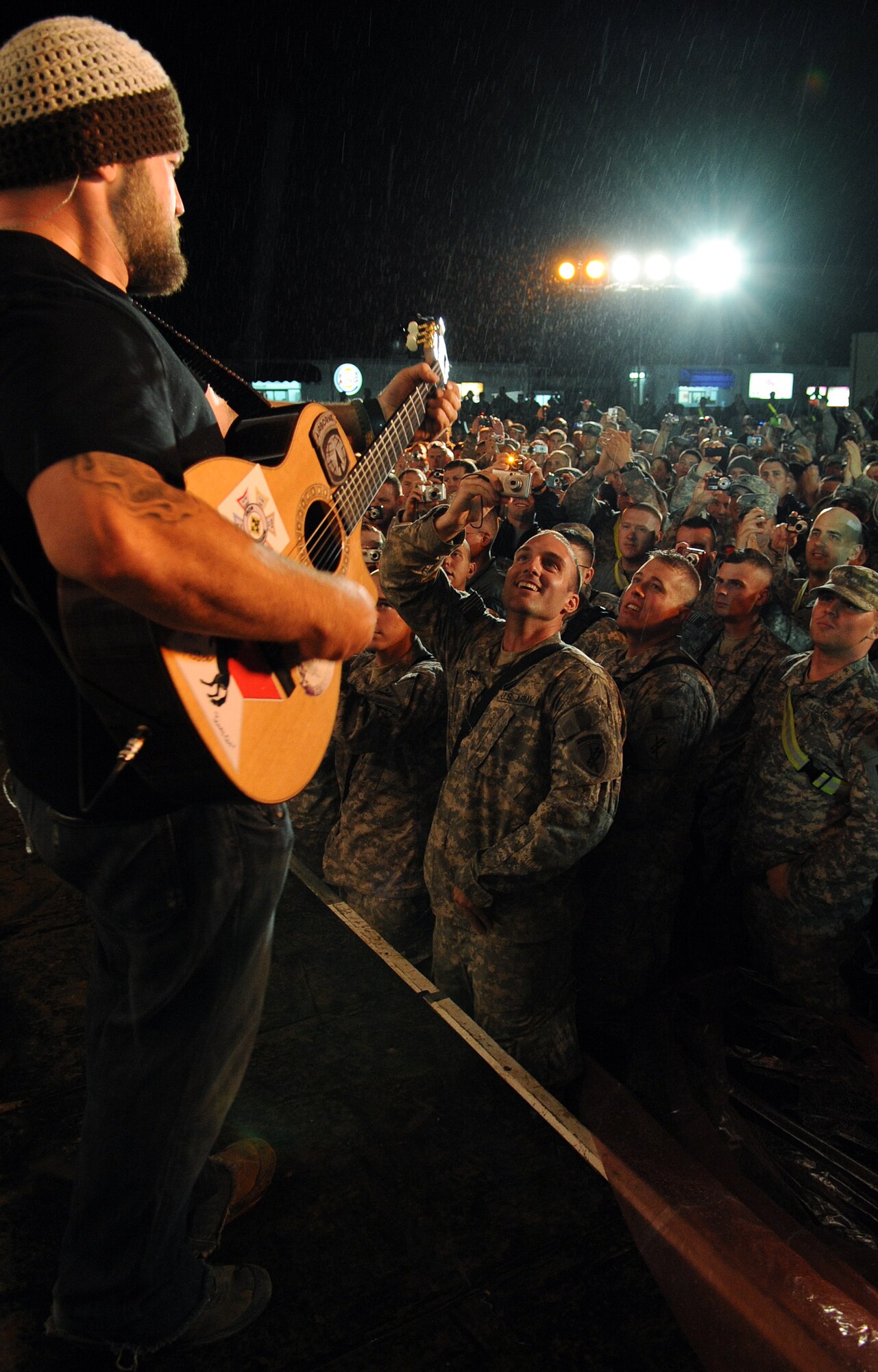 The Zac Brown Band brings a little piece of "down home" to the Airmen and
Soldiers stationed at Kirkuk Regional Air Base during their performance on
April 17, 2009.  The KRAB was just one of several visits the band made
during their week-long tour to Iraq. The band opted to spend time with
deployed troops rather than attend the Academy of Country Music Awards
happening this week in Las Vegas. They were up for three awards.  (U.S. Air
Force photo/Staff Sgt. Tabitha Kuykendall/Released)
