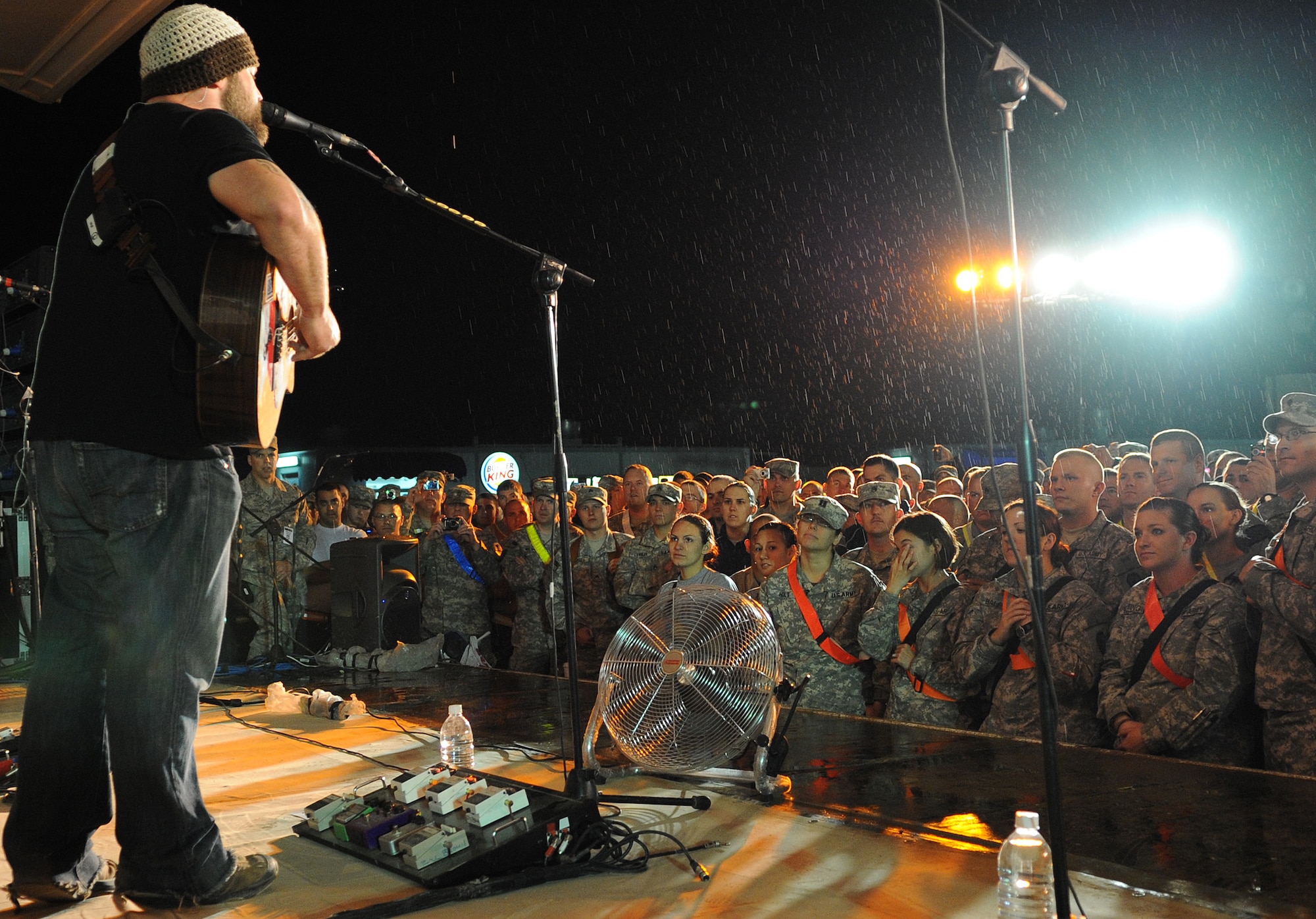The Zac Brown Band brings a little piece of "down home" to the Airmen and
Soldiers stationed at Kirkuk Regional Air Base during their performance on
April 17, 2009.  The KRAB was just one of several visits the band made
during their week-long tour to Iraq. The band opted to spend time with
deployed troops rather than attend the Academy of Country Music Awards
happening this week in Las Vegas. They were up for three awards.  (U.S. Air
Force photo/Staff Sgt. Tabitha Kuykendall/Released)
