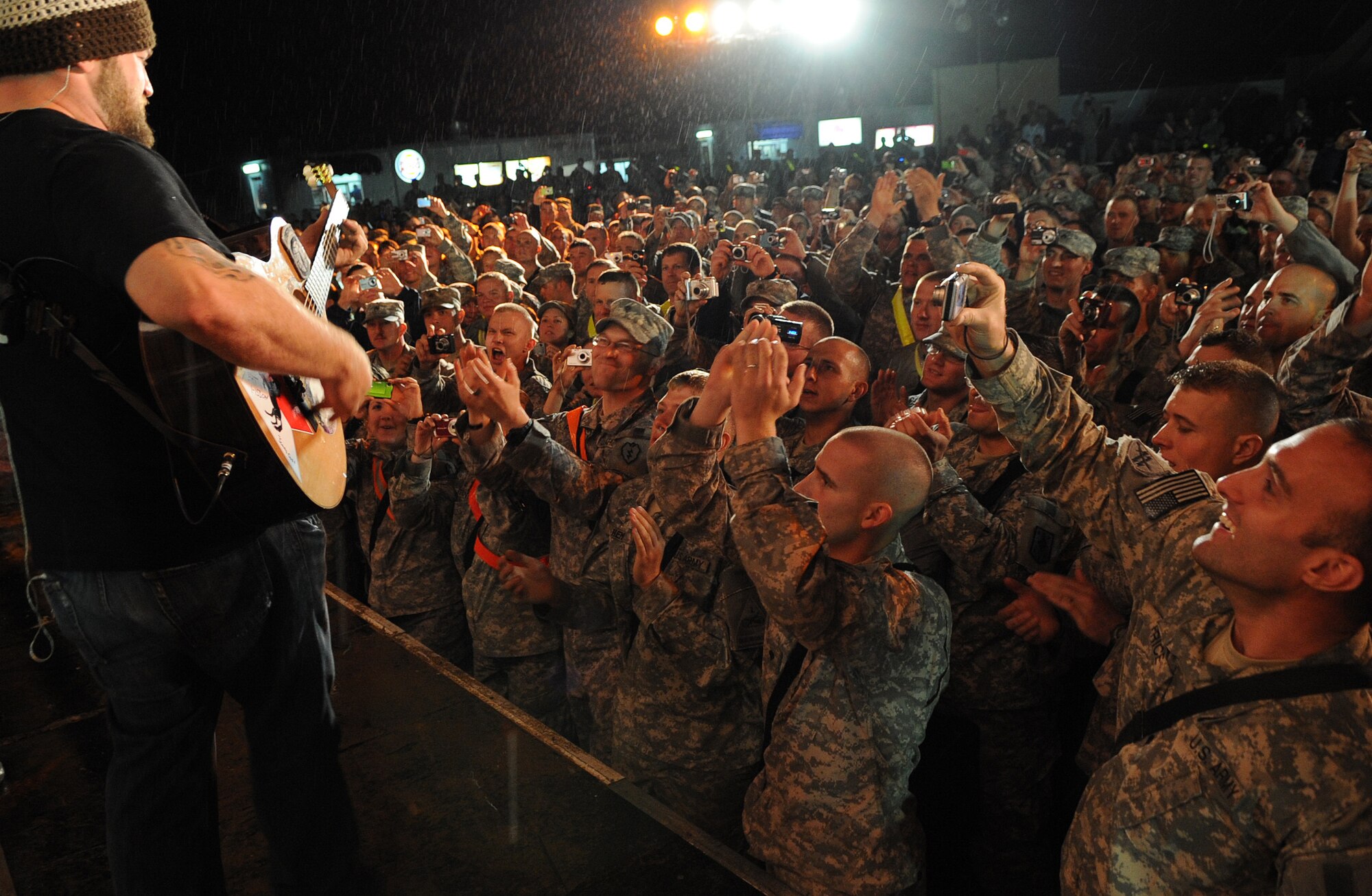 The Zac Brown Band brings a little piece of "down home" to the Airmen and
Soldiers stationed at Kirkuk Regional Air Base during their performance on
April 17, 2009.  The KRAB was just one of several visits the band made
during their week-long tour to Iraq. The band opted to spend time with
deployed troops rather than attend the Academy of Country Music Awards
happening this week in Las Vegas. They were up for three awards.  (U.S. Air
Force photo/Staff Sgt. Tabitha Kuykendall/Released)
