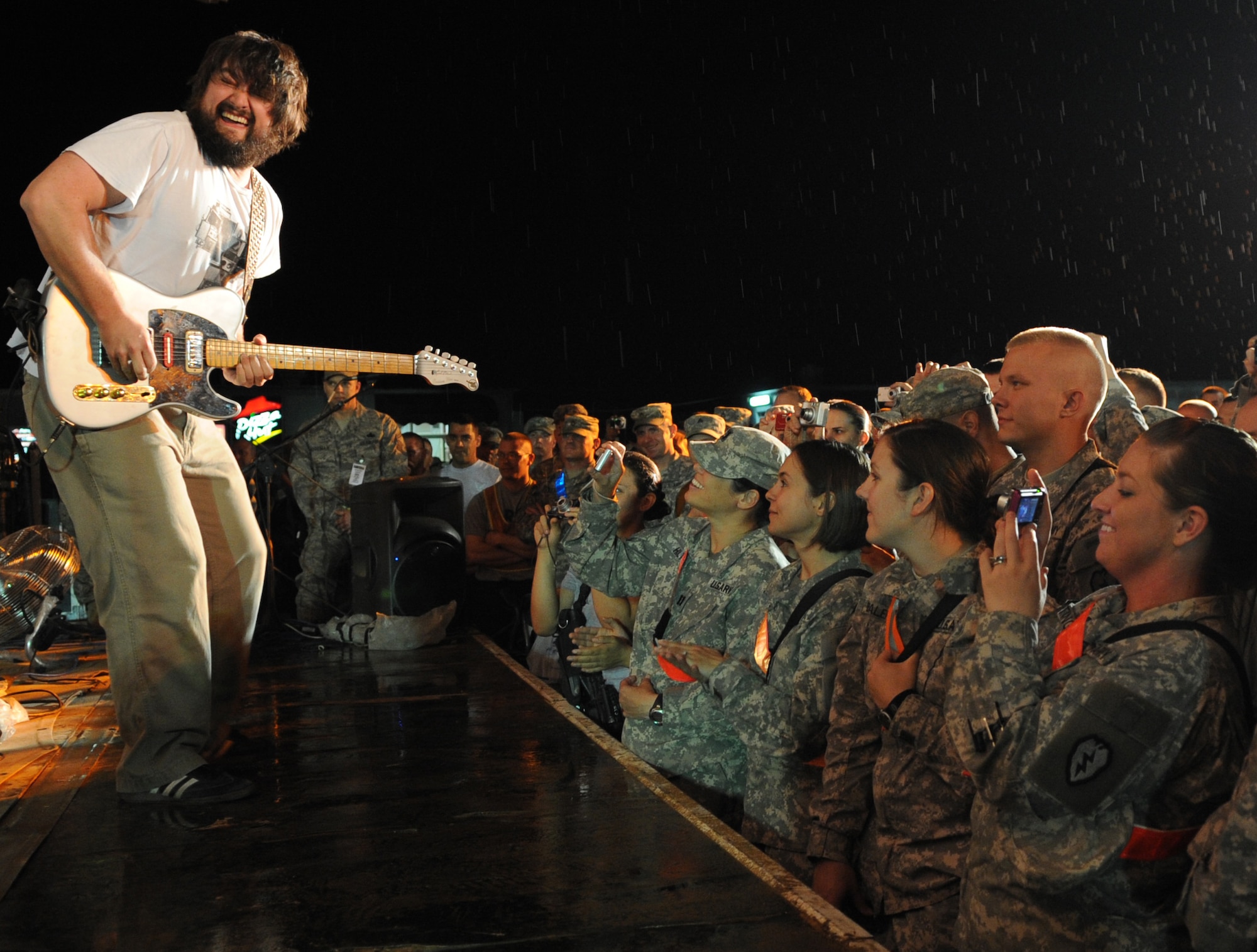 The Zac Brown Band brings a little piece of "down home" to the Airmen and
Soldiers stationed at Kirkuk Regional Air Base during their performance on
April 17, 2009.  The KRAB was just one of several visits the band made
during their week-long tour to Iraq. The band opted to spend time with
deployed troops rather than attend the Academy of Country Music Awards
happening this week in Las Vegas. They were up for three awards.  (U.S. Air
Force photo/Staff Sgt. Tabitha Kuykendall/Released)
