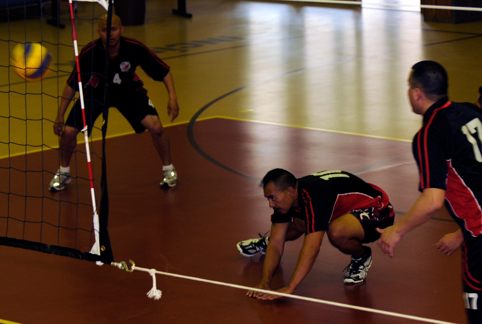 Senior Master Sgt. Garrett Kuwada, 39th Force Support Squadron, digs a serve from the Cukurova University men’s volleyball team Saturday, April 17, 2010 at Incirlik’s Fitness Center.  This is the second time the Incirlik varsity volleyball teams played the university team.  Both the men’s and women’s teams lost to their university counterparts two games to one.  (U.S. Air Force photo/Staff Sgt. Raymond Hoy)
