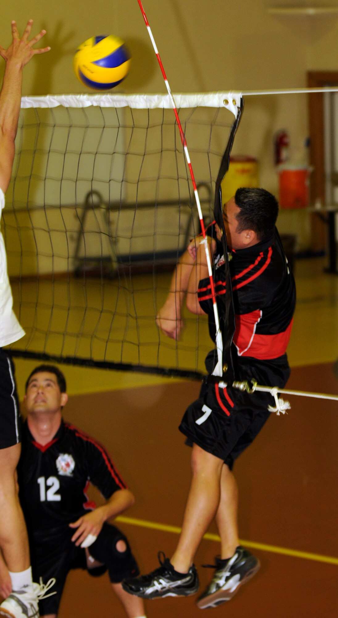 Staff Sgt. Philip Santos, 39th Security Forces Squadron, tries to spike the ball past members of the Cukurova University men’s volleyball team Saturday, April 17, 2010 at Incirlik’s Fitness Center.  This is the second time the Incirlik varsity volleyball teams played the university team.  Both the men’s and women’s teams lost to their university counterparts two games to one.  (U.S. Air Force photo/Staff Sgt. Raymond Hoy)