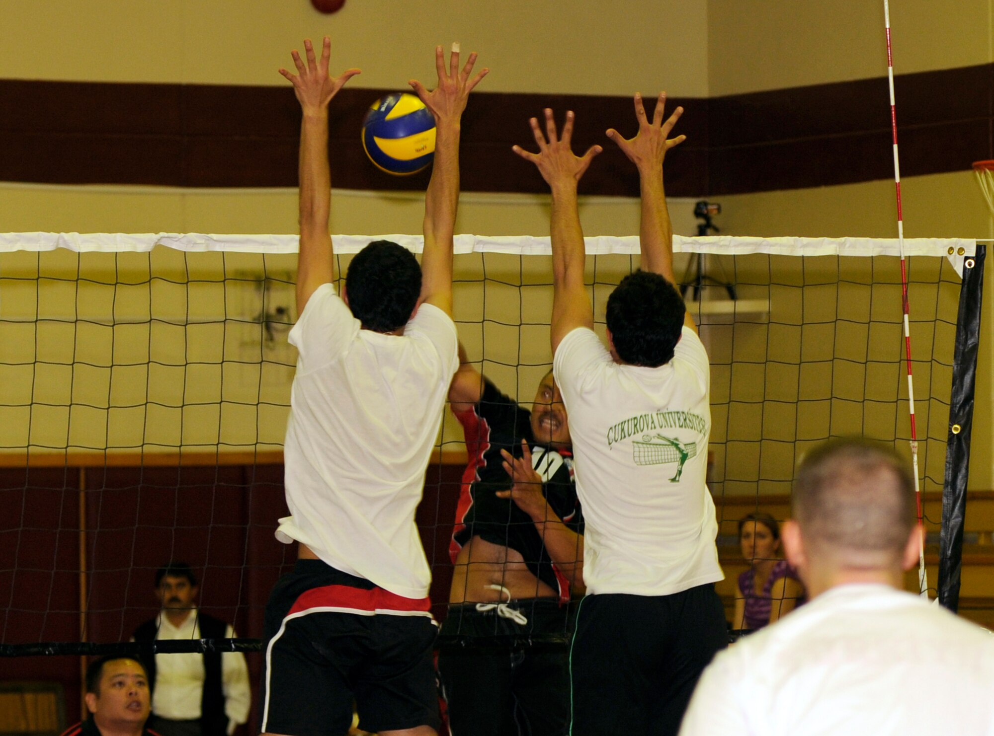 Senior Master Sgt. Garrett Kuwada, 39th Force Support Squadron, tries to spike the ball past members of the Cukurova University men’s volleyball team Saturday, April 17, 2010 at Incirlik’s Fitness Center.  This is the second time the Incirlik varsity volleyball teams played the university team.  Both the men’s and women’s teams lost to their university counterparts two games to one.  (U.S. Air Force photo/Staff Sgt. Raymond Hoy)