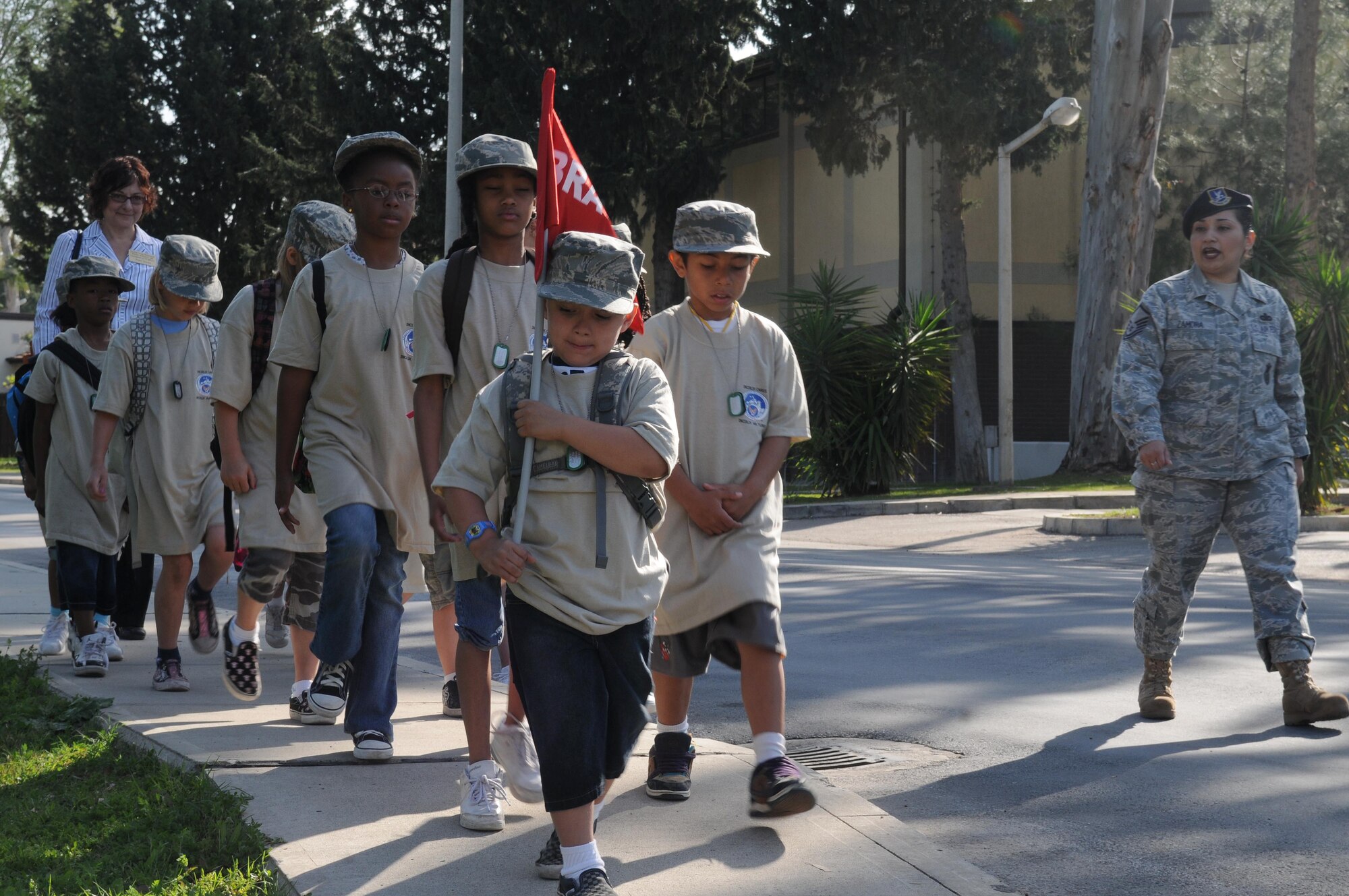Master Sgt. Liliana Zamora, 39th Security Forces Squadron, marches Bravo Flight toward the base theater during Operation Born Ready and Trained, a children’s mock deployment, Friday, April 16, 2010 at Incirlik Air Base, Turkey.  Operation BRAT was coordinated by the Airman and Family Readiness Center.   (U.S. Air Force photo/Senior Airman Ashley Wood)