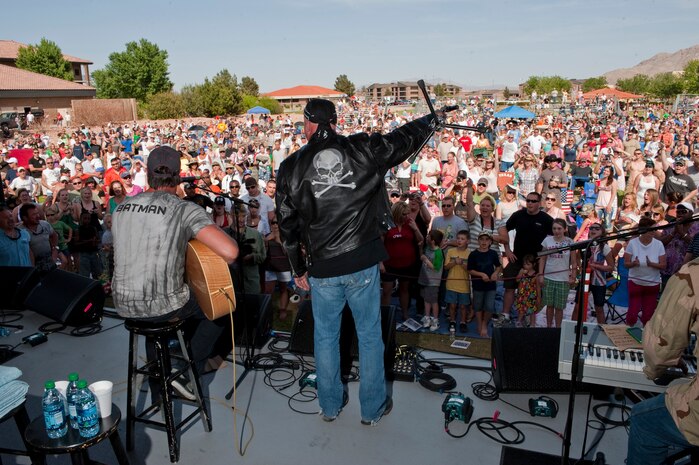 NELLIS AIR FORCE BASE, Nev. --   Montgomery Gentry perform to a packed crowd at the Nellis Sports Pavilion Saturday, April 17, 2010. Montgomery Gentry headlined the free concert hosted by the Academy of Country Music's charitable arm "Lifting Lives" and the USO. (U.S. Air Force photo by Tech. Sgt. Michael R. Holzworth)