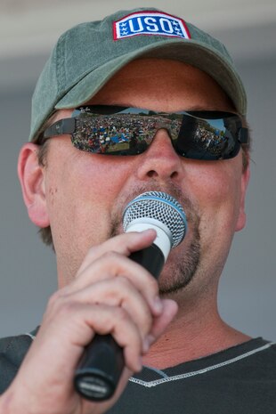 NELLIS AIR FORCE BASE, Nev. --   Storme Warren, host of the television show "Headline Country" introduces Dierks Bentley to the stage during the Academy of Country Music's USO concert at Nellis Air Force Base April 17, 2010. (U.S. Air Force photo by Tech. Sgt. Michael R. Holzworth)
