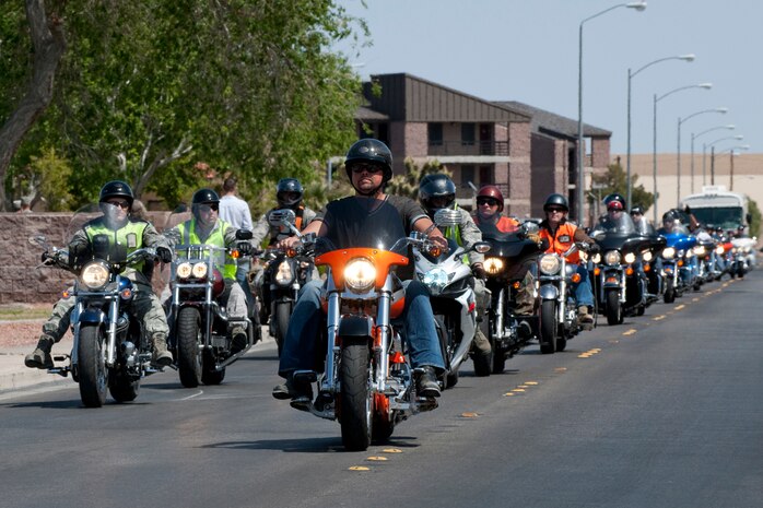 NELLIS AIR FORCE BASE, Nev. --  Over  50 motorcycles role into the Nellis Sports Pavilion for a free concert hosted by the Academy of Country Music's charitable arm "Lifting Lives" and the USO April 17, 2010. Nellis Airmen joined with country music stars for the Academy of Country Music Chairman's Ride in support the "Lifting Lives" charity.   (U.S. Air Force photo by Tech. Sgt. Michael R. Holzworth)
