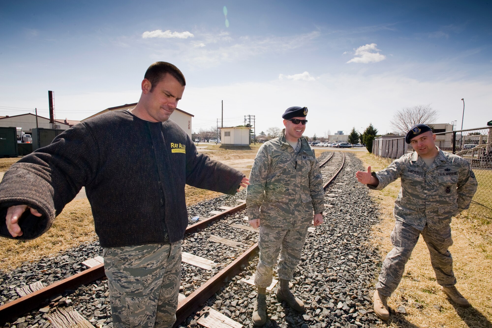 MISAWA AIR BASE, Japan -- Staff Sgt. George Shepherd, 35th Security Forces Squadron dog trainer, introduces Staff Sgt. Michael Stevens, 35th SFS dog handler, during a demonstration April 16 at the Cheli School Age facility. During the demonstration, Sergeant Stevens played the role of a culprit. The MWD handlers and trainers encouraged the school-age children to seek help from an adult if ever approached by someone suspicious who offers them drugs. (U.S. Air Force photo/Senior Airman Jamal D. Sutter)
