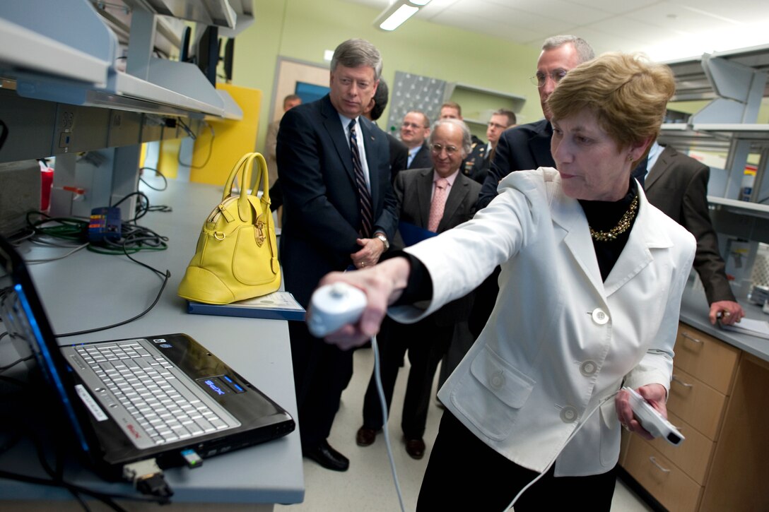 Deborah Mullen tries a customized Wii gaming system that helps test for traumatic brain injuries at the McGowan Institute for Regenerative Medicine's Entertainment Technical Center in Pittsburgh, April 19, 2010.