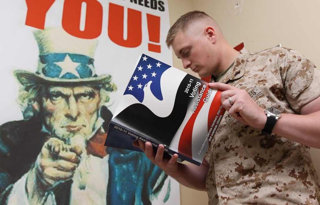 Cpl. Benjamin P. Callahan, administrative clerk, Adjutant Office, Marine Corps Base Camp Pendleton, skims through the 2010-11 Voting Assistance Guide at Bldg. 1160, Mainside, Camp Pendleton, April 19. Headquarters Marine Corps distributed their “In the Black” letter, released April 15, for guidance on political activity that encourages Marines and sailors to participate in the political process and voice their views, but while being aware of the rules and regulations related to political activity that govern the conduct of all service members. Department of Defense Directive 1344.10 and DOD Instruction 1325.06 both give additional details concerning permissible political activities for troops.