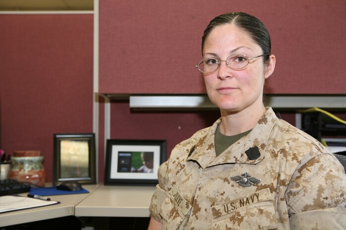Petty Officer 1st Class Jennifer Kleve, a hospital corpsman and the administration chief for 2nd Medical Logistics Company, 2nd Supply Battalion, 2nd Marine Logistics Group, sits in her office aboard Camp Lejeune, N.C., April 20, 2010.  Kleve is one of many dual military families who have endured combat deployments since the global war on terror began nine years ago.