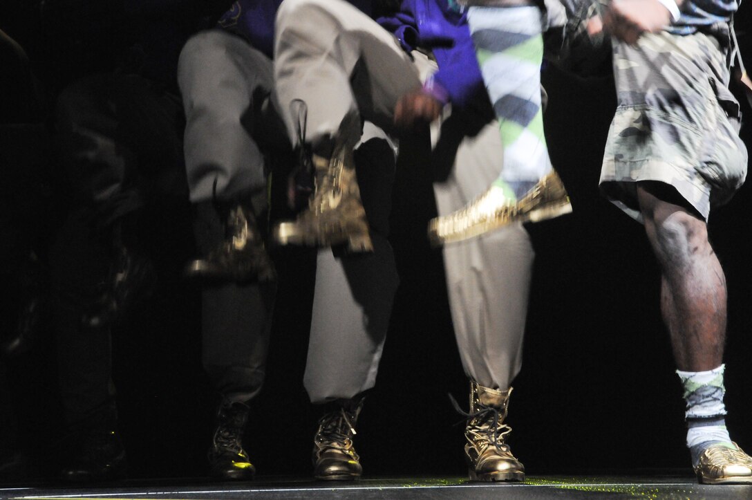 The men of Omega Psi Phi, University of Oklahoma Chapter, stomp in line during their performance at the 2011 OU Stompdown Showcase, April 30. The Marine Corps chose to sponsor this event in order to show an appreciation and interest in the black community. The Black Student Association's leaders said they were more than willing to have the Corps' support.