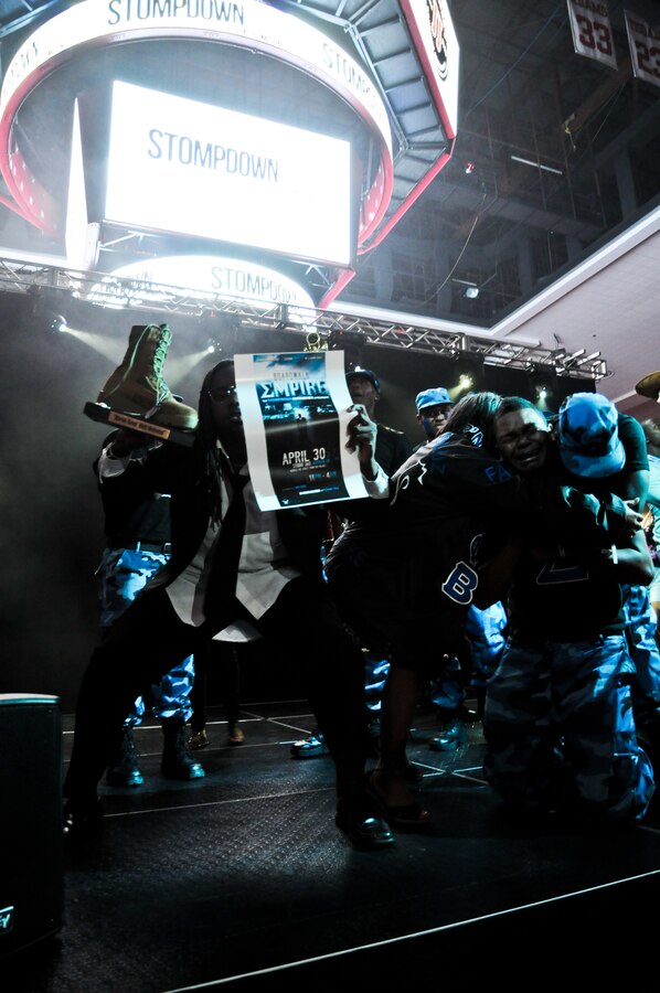A member of the Sigma Phi Beta University of Oklahoma Chapter, displays the "Marine Corps' Most Motivated Award” while the emotional moment of being named the 2011 OU Stompdown Showcase champions overwhelms his fellow teammate, April 30.