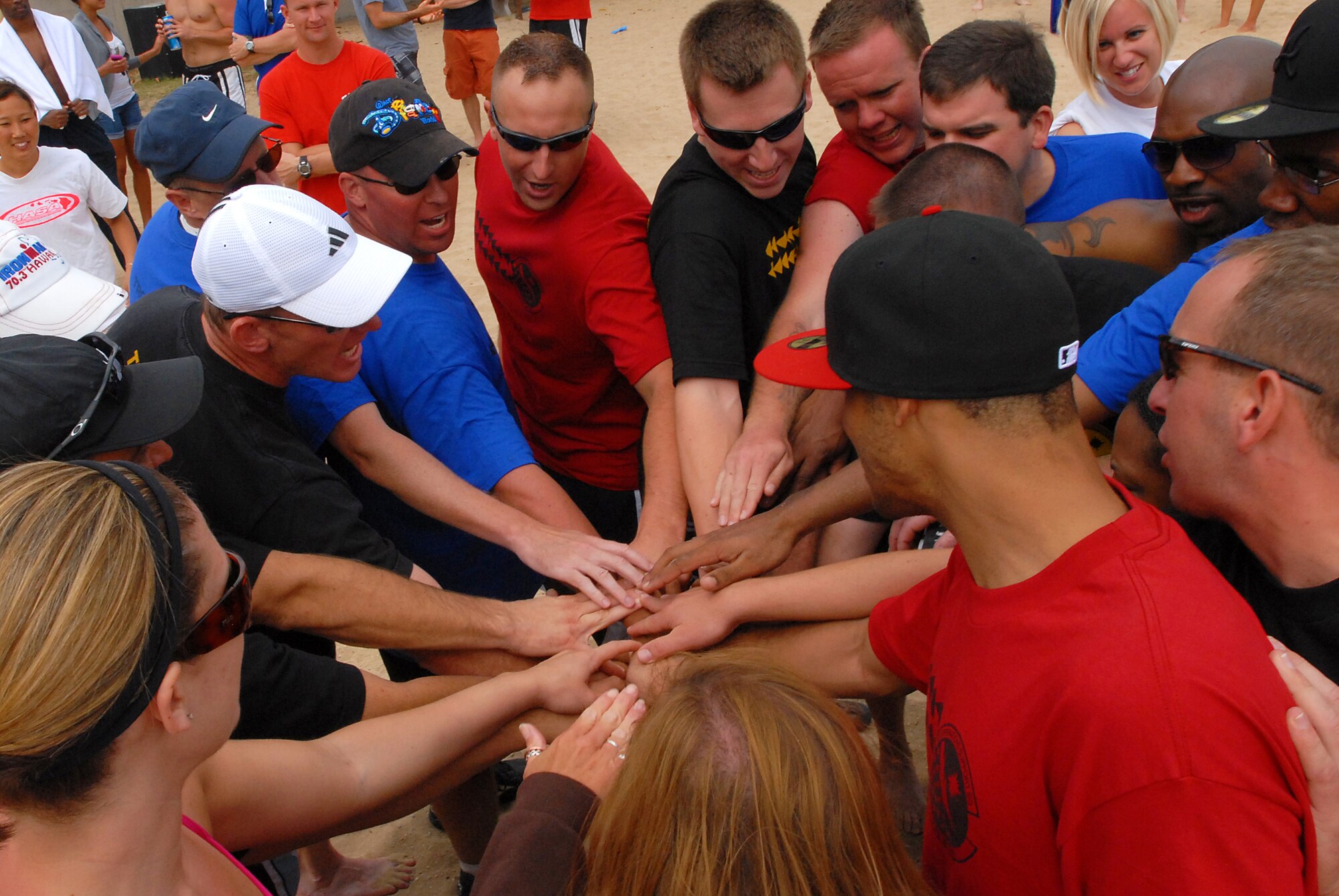 JOINT BASE PEARL HARBOR HICKAM, Hawaii -- The 15th Operations Support Squadron gets all hand in and pumped up for the final tug-o-war match against the 735th Aircraft Maintenance Squadron at Hickam's annual Sports Day at Hickam Harbor April 16. The 735th AMS pulled harder in the end to outlast the 15th OSS. The entire day of activities included innertube relay race, fitness challenge, volleyball, kayak races, horseshoe toss and the tug-o-war. At the end of the day, the Chiefs took down the Eagles in a volleyball game. (U.S. Air Force photo by Staff Sgt. Mike Meares)