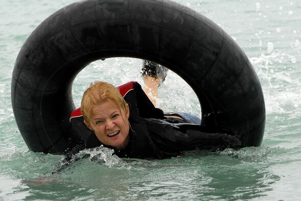JOINT BASE PEARL HARBOR HICKAM, Hawaii ? Lt. Col. Ramona Fulkerson, Det. 1 692nd Intelligence Surveillance Reconnaissance Group, paddles an inner tube during Hickam's annual Sports Day at Hickam Harbor April 16. The 535th Airlift Squadron paddled their tubes to the fastest time while the 15th Maintenance Squadron and the 15th Comptroller Squadron took second and third respectively. (U.S. Air Force photo by Staff Sgt. Mike Meares)