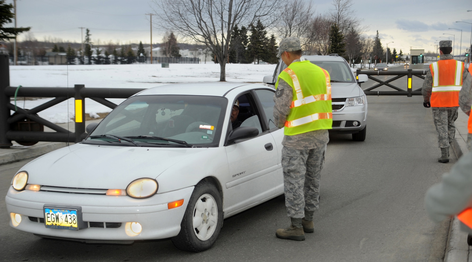 ELMENDORF AIR FORCE BASE, Alaska -- Elmendorf Airmen pass out Wingman Pledge cards to ensure everyone has a back-up plan for their weekend activities. The cards contain a pledge to not drink and drive and have  numbers to call when in need of a ride. (Air Force photo by Senior Airman Kristin High)