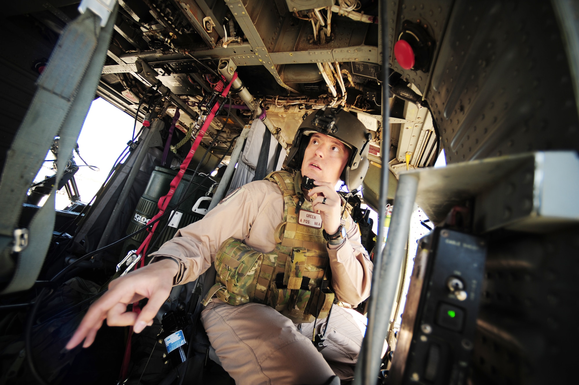 Staff Sgt. Andrew Green performs a pre-flight checklist during Angel Thunder 2010, April 15, 2010, near Davis-Monthan Air Force Base, Ariz.  Angel Thunder 2010, an Air Combat Command sponsored exercise, will be the largest personnel recovery and combat search and rescue exercise to date, combining Department of Defense and non-DOD assets.  (U.S. Air Force photo/Staff Sgt. Joshua L. DeMotts) 