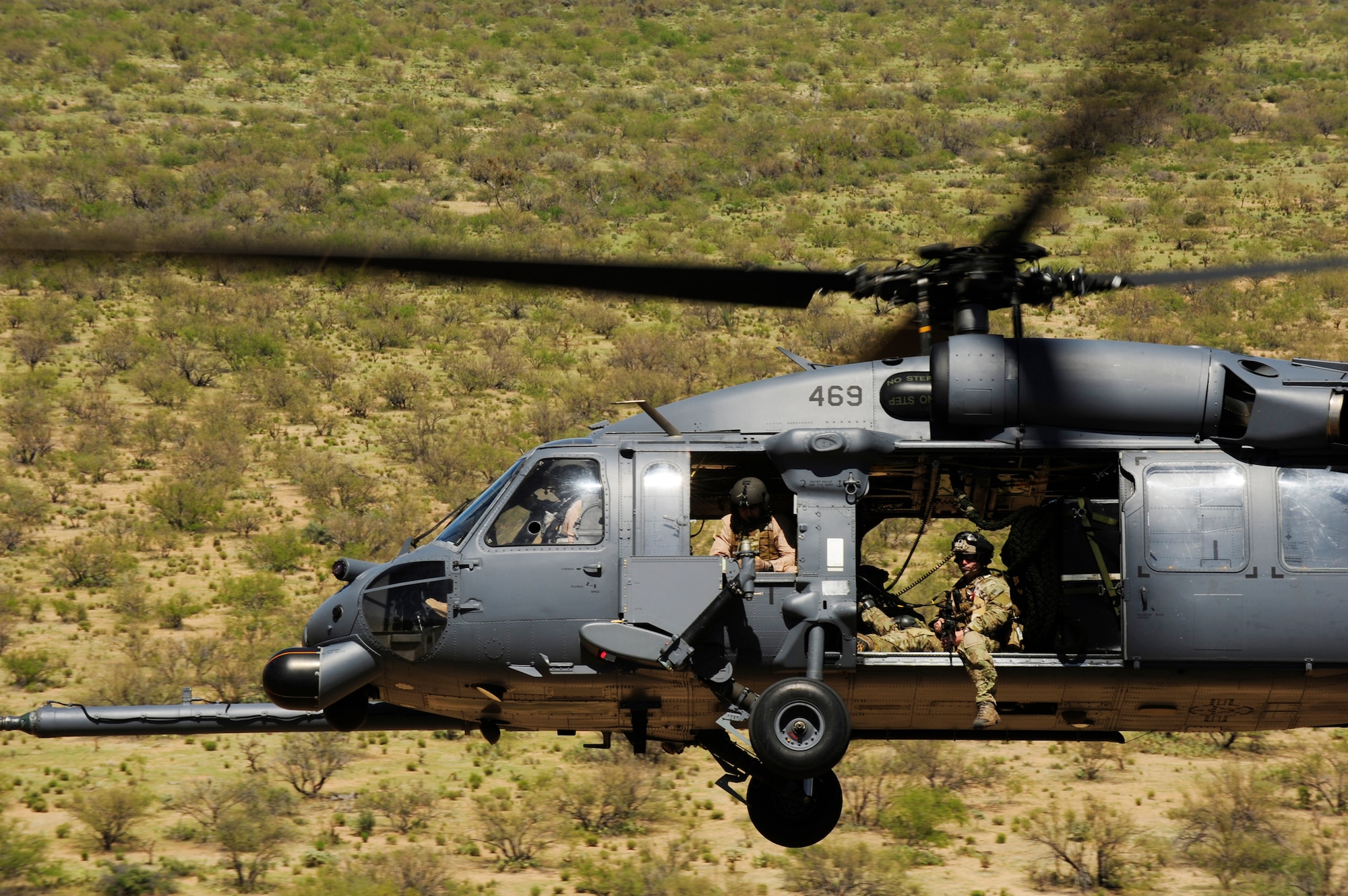 An HH-60 Pave Hawk flies over the desert surrounding Davis-Monthan Air Force Base, Ariz., during Angel Thunder 2010, April 15, 2010. The Pave Hawk crew is from the Alaska Air National Guard's 210th Rescue Squadron at Kulis ANG Base in Anchorage, Alaska. (U.S. Air Force photo/Staff Sgt. Joshua L. DeMotts)
