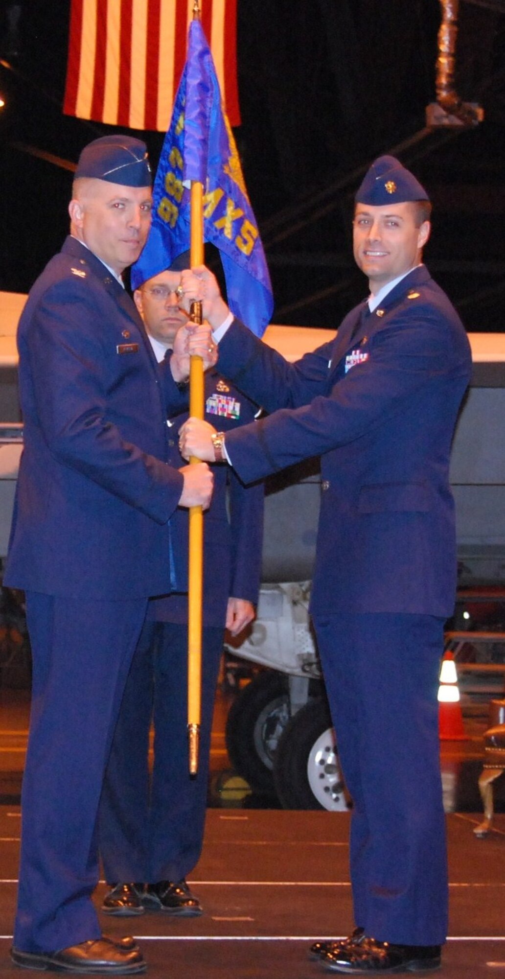 Maj. Wes Adams (right), incoming 982nd Maintenance Squadron commander, accepts the command of the squadron from Col. John Rausch (left), 982nd Training Group commander, April 19, 2010 during the squadron’s change-of-command ceremony at hangar 1360 Sheppard Air Force Base, Texas. (U.S. Air Force Photo/Tech Sgt. Donald Bozeman)