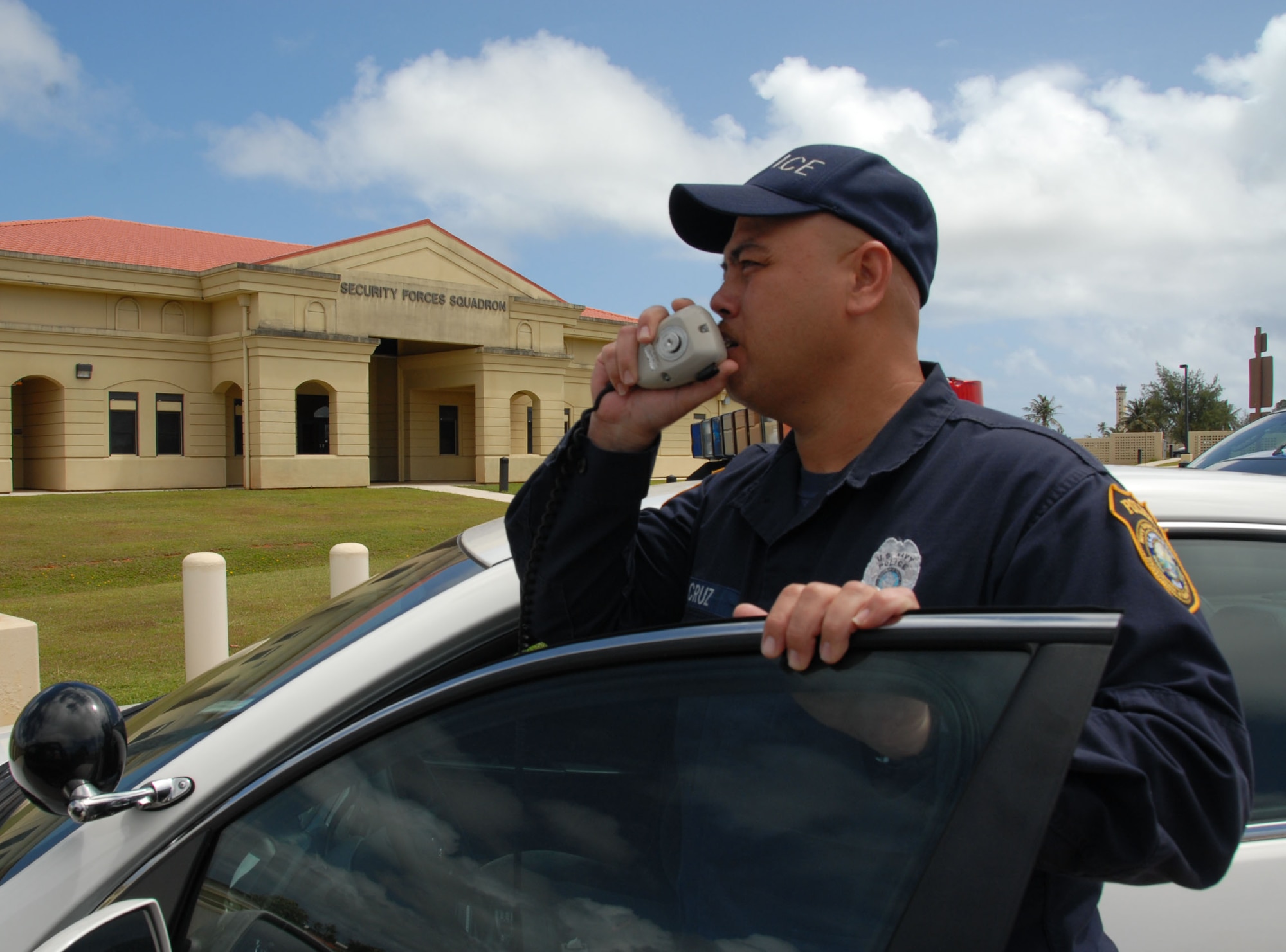 ANDERSEN AIR FORCE BASE, Guam -- Sgt. Jesse Cruz, a security contractor calls for back up during a security forces training mission, here April 16. Sergeant Cruz is the lead police officer for the Air Force security integration recruitment program on Andersen Air Force Base (U.S. Air Force photo by Staff Sgt. Derrick Spencer)