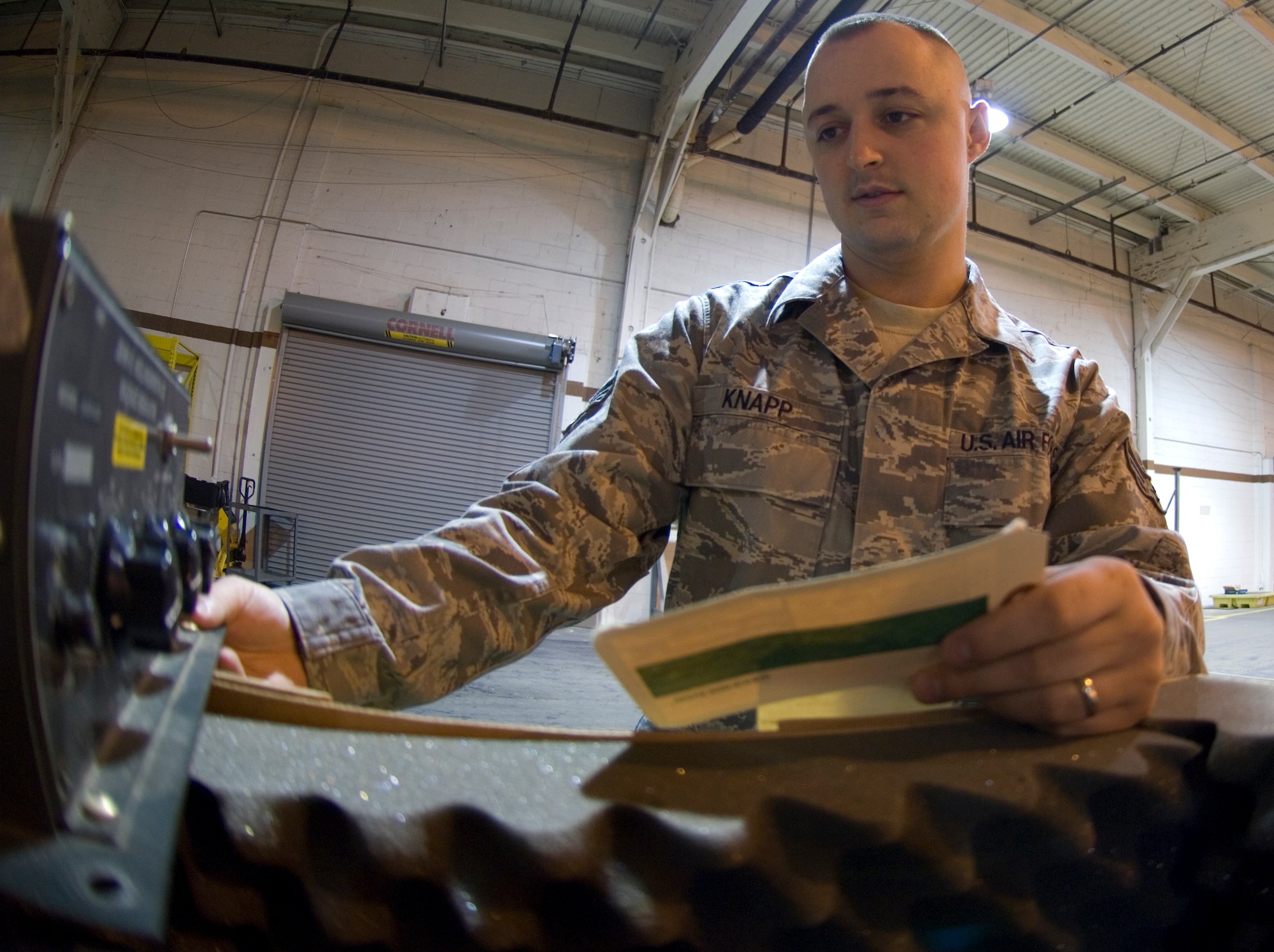 Senior Airman Josh Knapp, 22nd Logistics Readiness Squadron maintenance support liaison, inspects incoming mission capable aircraft equipment for the 22nd Maintenance Group, April 19, 2010. Airman Knapp acts as the go-between for the 22nd LRS and 22nd MXG, for all incoming and outgoing MICAP aircraft equipment.  (U.S. Air Force photo/Senior Airman Abigail Klein)