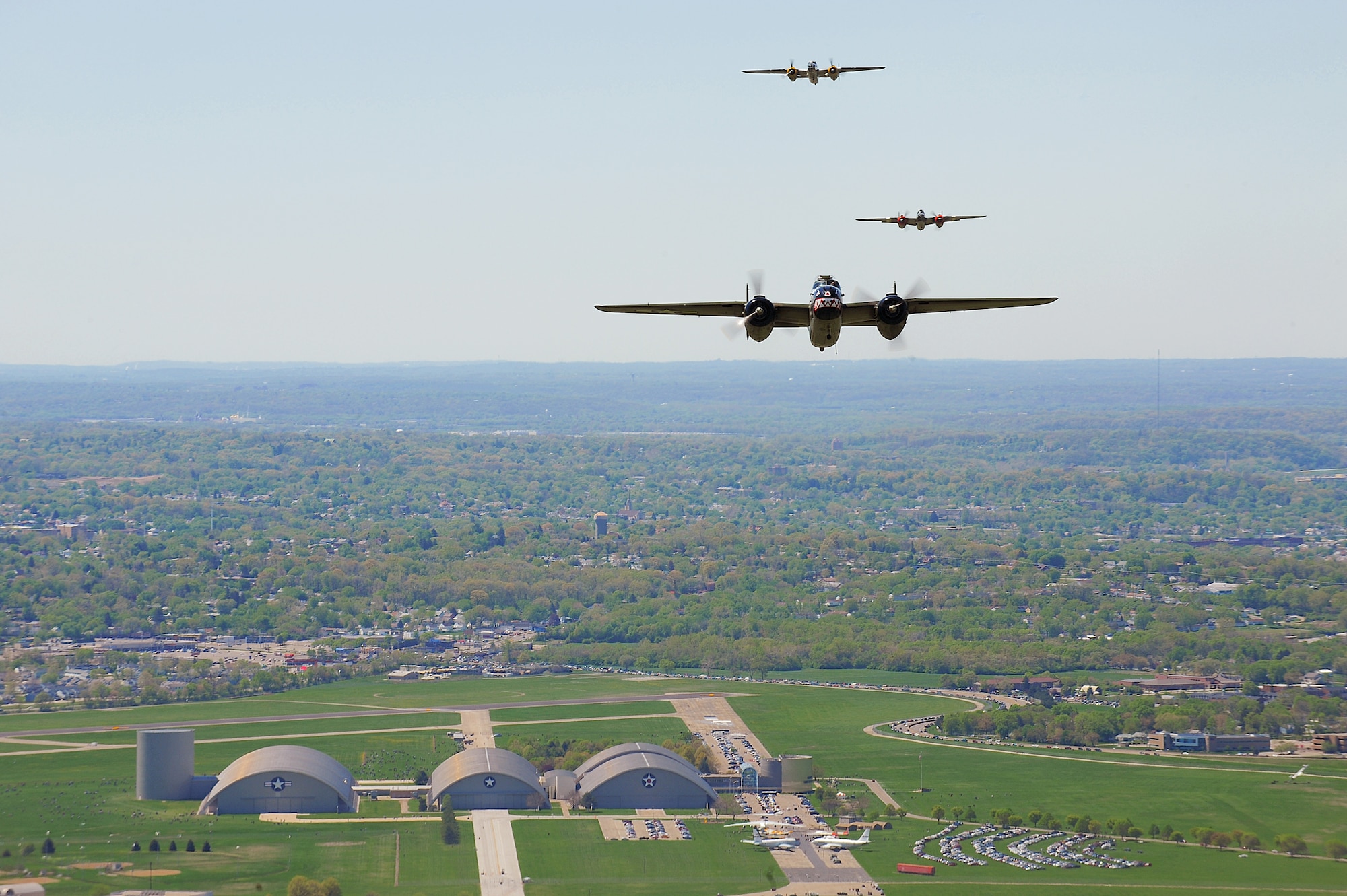 Vintage B-25 Mitchell bombers fly over the National Museum of the U.S. Air Force at Wright-Patterson Air Force Base, Ohio, during a memorial flight honoring the Doolittle Tokyo Raiders on April 18, 2010.  The 68th Doolittle Raiders' reunion commemorates the anniversary of the Doolittle Tokyo Raid.  On April 18, 1942, U.S. Army Air Forces Lt. Col. Jimmy Doolittle's squad of 16 B-25 Mitchell aircraft bombed Japanese targets in response to the attack on Pearl Harbor. (U.S. Air Force photo/Tech. Sgt. Jacob N. Bailey)


