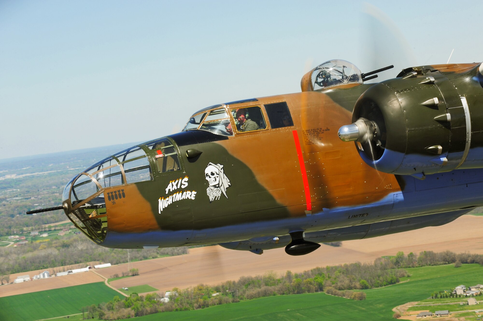 A vintage B-25 Mitchell bomber flies near the National Museum of the U.S. Air Force at Wright-Patterson Air Force Base, Ohio, during a memorial flight honoring the Doolittle Tokyo Raiders on April 18, 2010.  The 68th Doolittle Raiders' reunion commemorates the anniversary of the Doolittle Tokyo Raid.  On April 18, 1942, U.S. Army Air Forces Lt. Col. Jimmy Doolittle's squad of 16 B-25 Mitchell aircraft bombed Japanese targets in response to the attack on Pearl Harbor. (U.S. Air Force photo/Tech. Sgt. Jacob N. Bailey)

