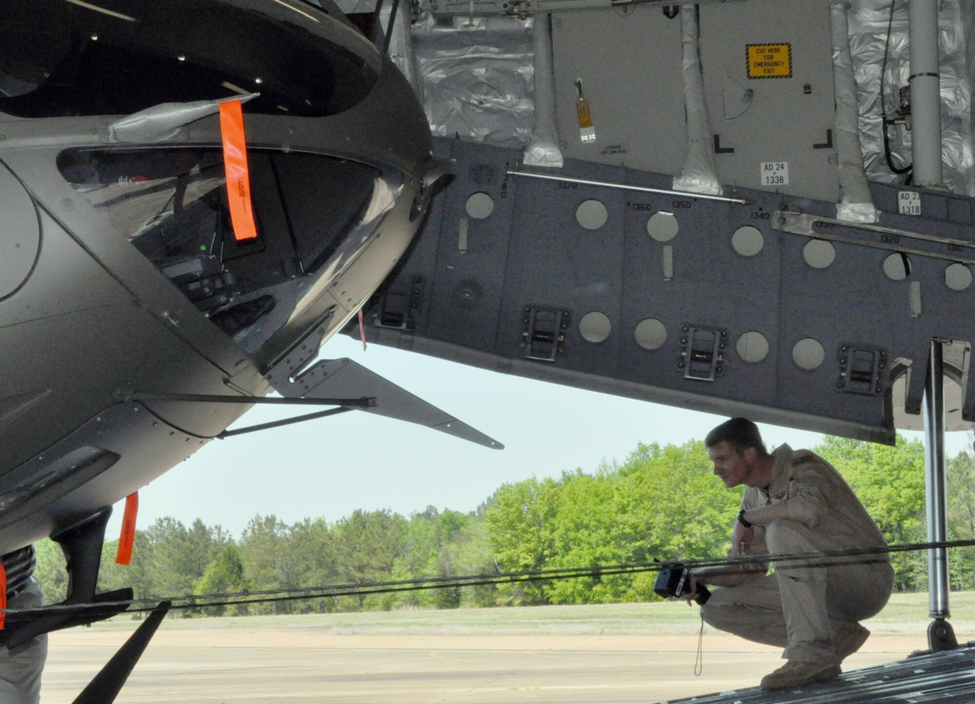Tech. Sgt. Charles Boulton operates the winch on a C-17 Globemaster III to pull a UH-72 Lakota into the aircraft April 12, 2010, at Columbus Air Force Base, Miss. Sergeant Boulton is a C-17 loadmaster assigned to the 172nd Airlift Wing. (U.S. Air Force photo/Senior Airman Jacob Corbin)