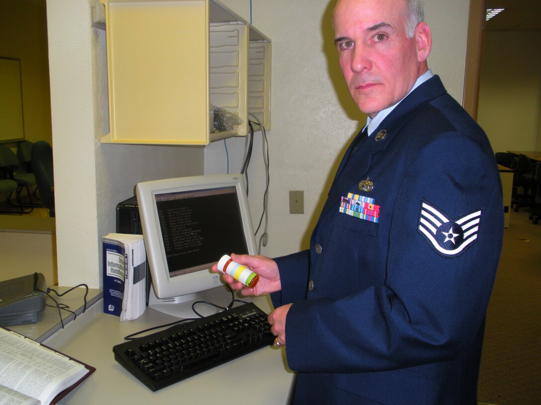 Staff Sgt. Michael Summers, a graduate of the 382nd Training Squadron Pharmacy Apprentice Course, reviews patient medication while entering information into the Composite Healthcare Computer System. Sergeant Summers received the Ace Award at his graduation April 1, 2010, for maintaining a cumulative average of 100 percent through six blocks of instruction. He is the first student to earn the Ace Award for the course in 10 years. (U.S. Air Force Photo/Bennie Brashear)