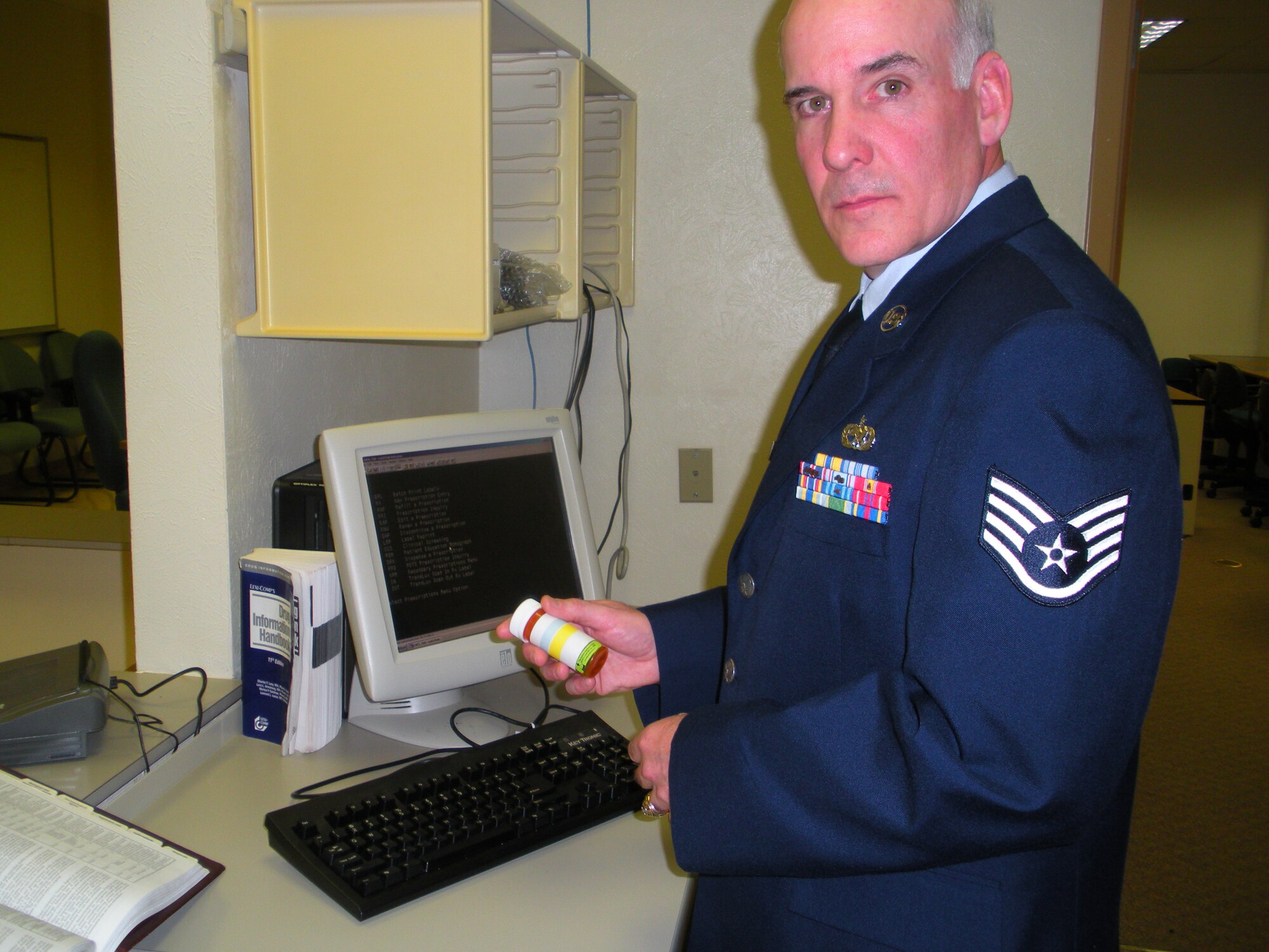 Staff Sgt. Michael Summers, a graduate of the 382nd Training Squadron Pharmacy Apprentice Course, reviews patient medication while entering information into the Composite Healthcare Computer System. Sergeant Summers received the Ace Award at his graduation April 1, 2010, for maintaining a cumulative average of 100 percent through six blocks of instruction. He is the first student to earn the Ace Award for the course in 10 years. (U.S. Air Force Photo/Bennie Brashear)