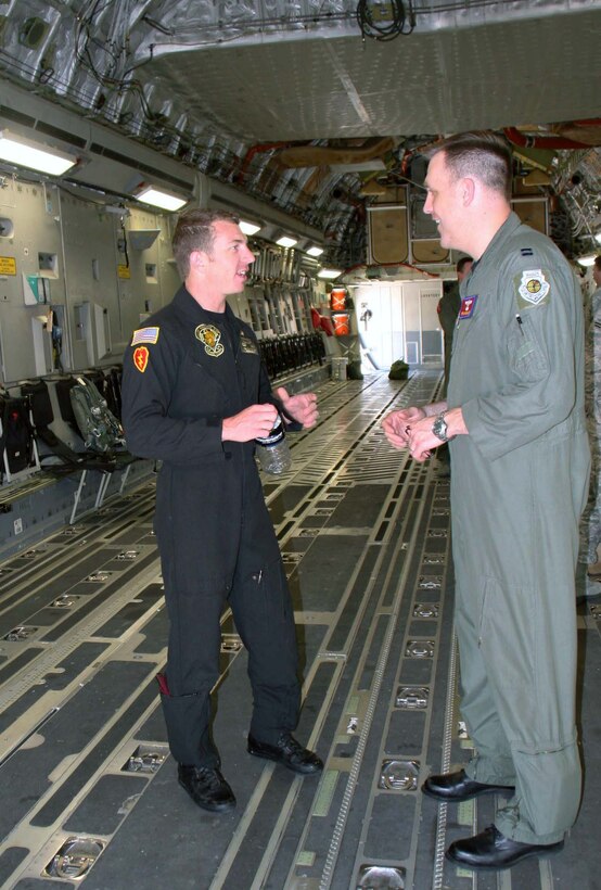Army Staff Sgt. Ben Borger (left) of the Army parachute team the Golden Knights, and Capt. Bryan Bailey perform a walkthrough of a C-17 Globemaster III April 13, 2010, at Altus Air Force Base, Okla. Sergeant Borger jumped out of the plane at an altitude of 32,000 feet and is currently awaiting confirmation of the new set record from the Guinness Book of World Records. Captain Bailey is the C-17 aircraft commander. (U.S. Army photo)