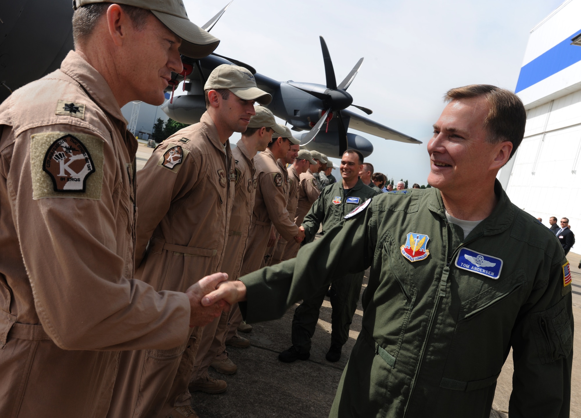 MARIETTA, Ga. -- Lt. Col. Joel Martin, 347th Operations Support Squadron commander, shakes hands with Maj. Gen. Thomas Andersen, Air Combat Command director of requirements, during the unveiling ceremony for the HC-130J Super Hercules here April 19. General Andersen is responsible for all functions relating to the acquisition of weapon systems for combat air forces. (U.S. Air Force photo by Airman 1st Class Benjamin Wiseman/RELEASED)