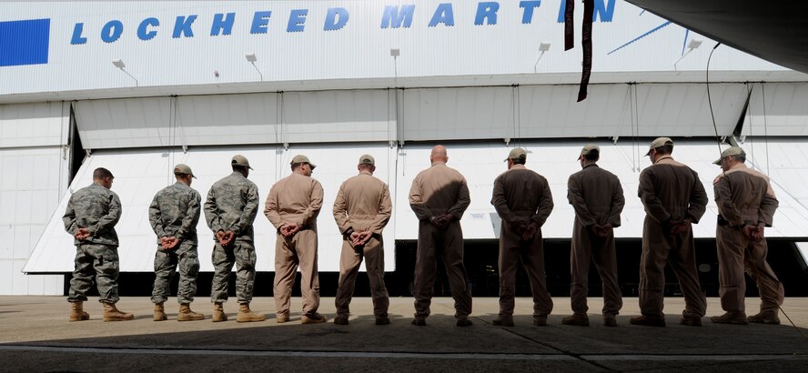 MARIETTA, Ga. -- Rescue personnel from Langley, Moody and Davis-Monthan Air Force Bases stand in front of the first HC-130J Super Hercules produced as it is unveiled to the public here April 19. This J-model will be sent to Davis-Monthan AFB after it undergoes initial testing. Moody is scheduled to receive its first J-model in 2012 once the aircraft reaches initial operating capability. (U.S Air Force photo by Airman 1st Class Benjamin Wiseman/RELEASED)