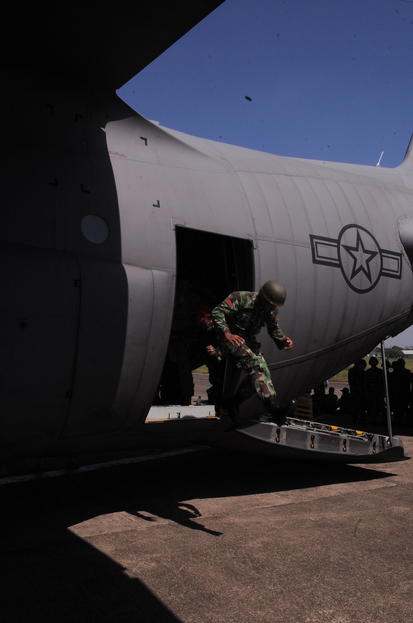 An Indonesian Air Force airman jumps from a U.S. Air Force C-130 Hercules during  exercise Cope West at Halim Air Base, Indonesia, April 17.  Cope West is a Pacific Air Forces- sponsored bilateral tactical airlift exercise involving the U.S. and Indonesian Air Forces.  The exercise is designed to advance interoperability between the U.S. and Indonesian Air Forces, and promote cooperation and unity of purpose. Cope West 10 is scheduled through April 23. (U.S. Air Force photo/ 1st Lt. John Harden)