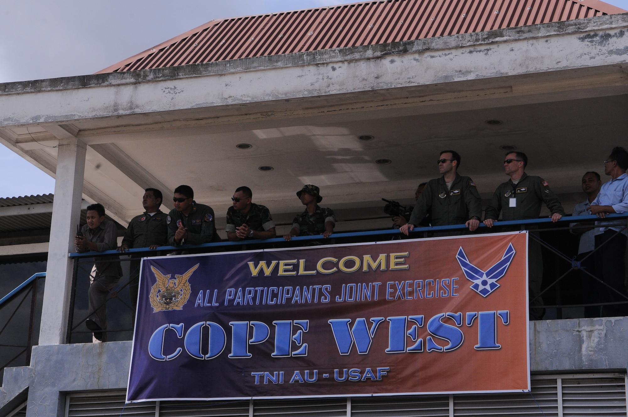 Two U.S Air Force officers discuss various scenarios that U.S. and Indonesian airmen will participate in during exercise Cope West 10 at Halim Air Base, Indonesia, April 17.  Cope West is a Pacific Air Forces- sponsored bilateral tactical airlift exercise involving the U.S. and Indonesian Air Forces.  The exercise is designed to advance interoperability between the U.S. and Indonesian Air Forces, and promote cooperation and unity of purpose. Cope West 10 is scheduled through April 23. 