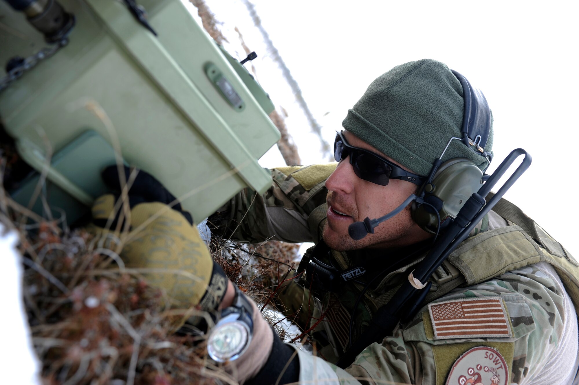 A special operations weather team operator out of Hurlburt Field enables a remote cloud pod during a training operation for Red Flag-Alaska 10-2 April 15, 2010, Eielson Air Force Base, Alaska. The cloud pod is one of several sensors that make up the weather pod and deployment of these down range is critical to the success of air operations. (U.S. Air Force photo/Airman 1st Class Willard E. Grande II)