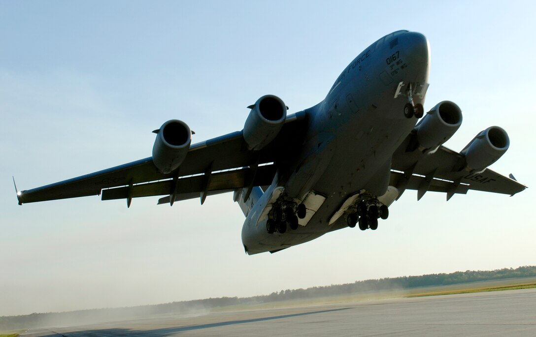 A C-17 Globemaster III aircrew takes off April 15, 2010, from Fort Pickett Maneuver Training Center, Va. The plane, carrying a group of Navy SEALs, was part of a joint training exercise with 517th Airlift Squadron members from Elmendorf Air Force Base, Alaska and SEAL Team 10. (U. S. Air Force photo/Staff Sgt. Brian Ferguson)