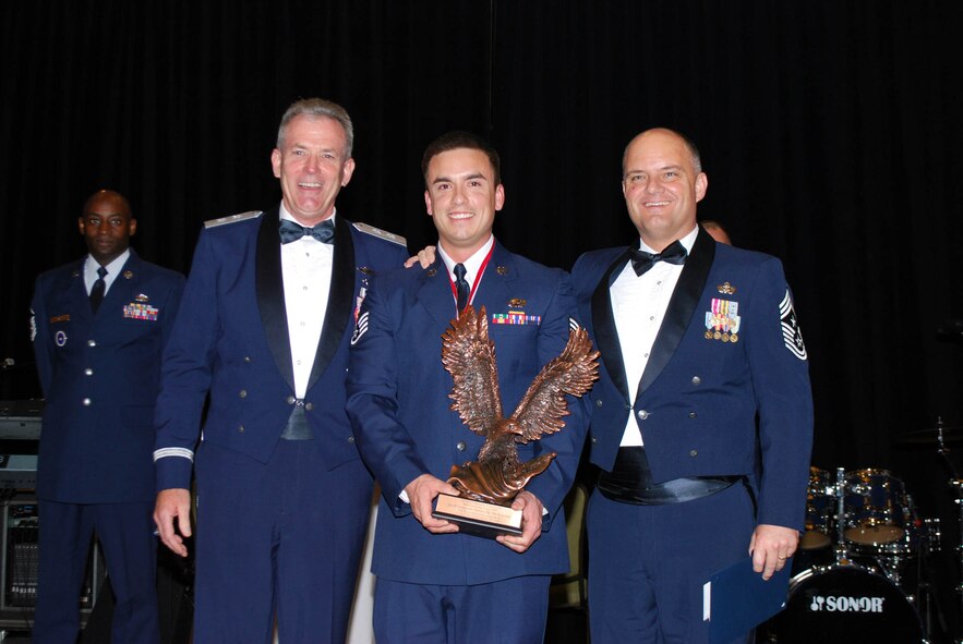 Staff Sgt. McKeown (center) accepts his Outstanding Airmen of the Year award with Maj. Gen. Brian P. Meenan (left), mobilization assistant to the Chief of Staff of the U.S. Air Force, and Chief Master Sgt. Dwight D. Badgett, Command Chief Master Sergeant for Air Force Reserve Command, during a ceremony at Robins Air Force Base, Ga., on Apr. 14. (U.S. Air Force photo/Staff Sgt. Celena Wilson, Air Force Reserve Command public affairs)
