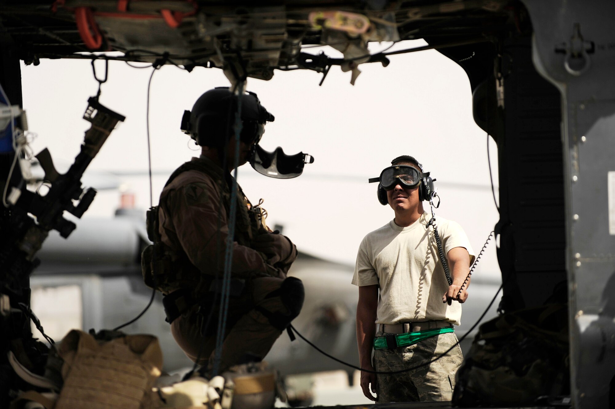 Senior Airman Robert Fabela observes the rotors as a pilot shuts down the engines after returning from an alert mission April 16, 2010, at Camp Bastion, Afghanistan. Airman Fabela is an HH-60 Pave Hawk crew chief assigned to the 451st Expeditionary Aircraft Maintenance Squadron helicopter maintenance unit.  (U.S. Air Force photo/Staff Sgt. Manuel J. Martinez)